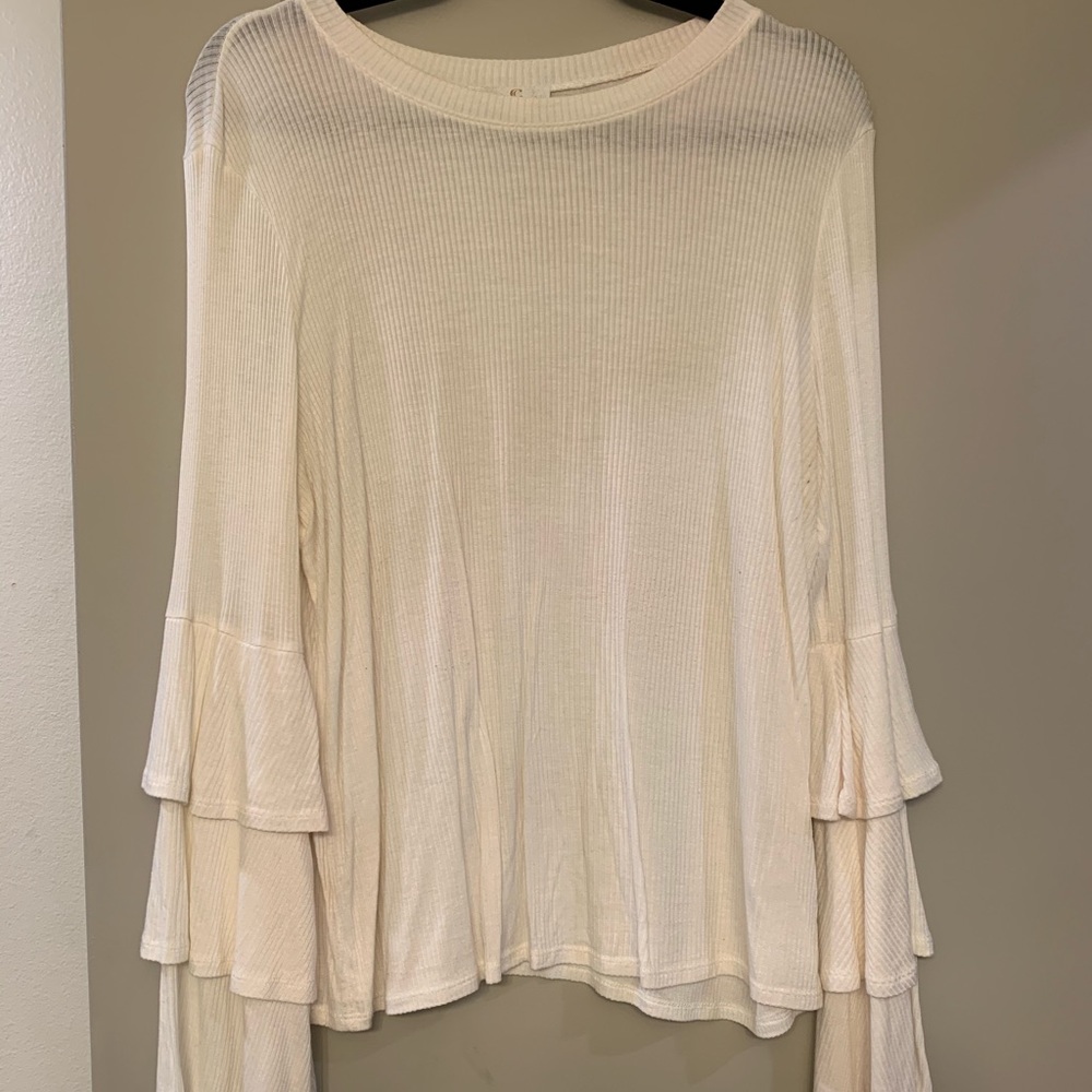 white long sleeve top with ruffle sleeves